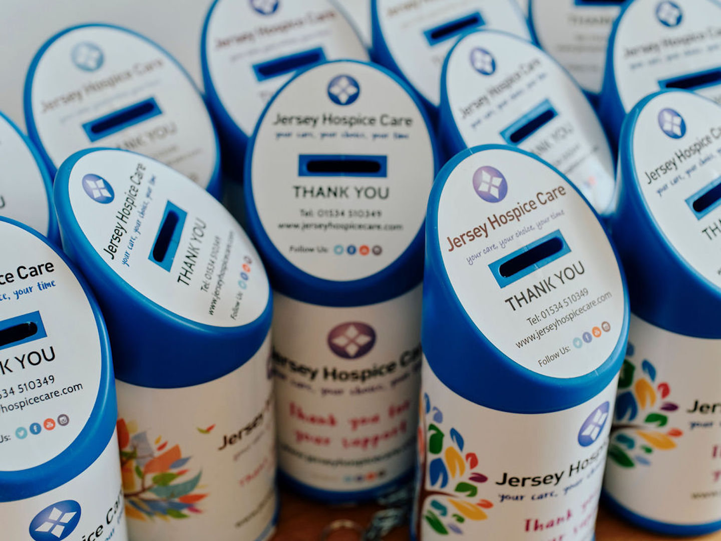 Image of blue Jersey Hospice Care collection tins