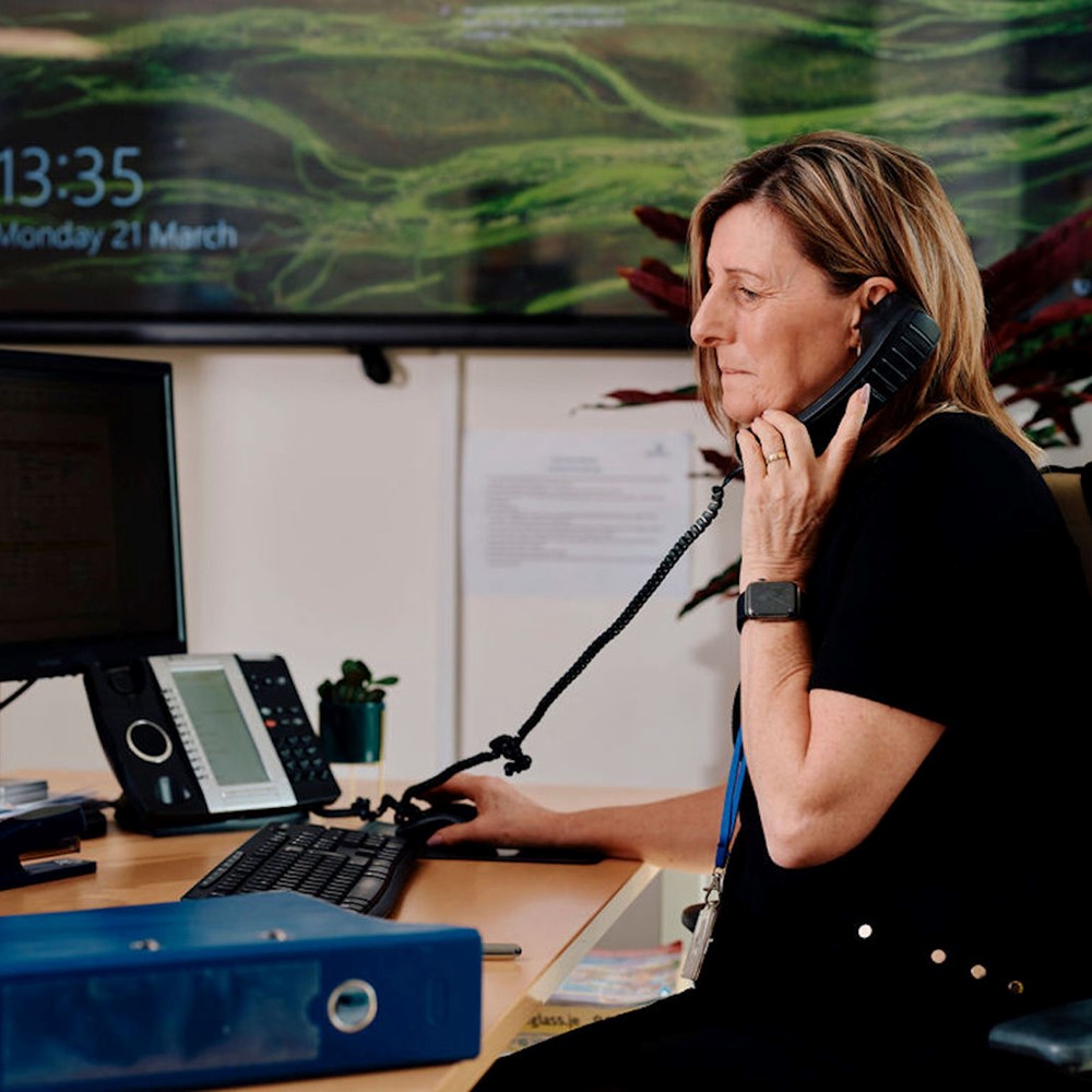Image of Hospice employee answering the telephone