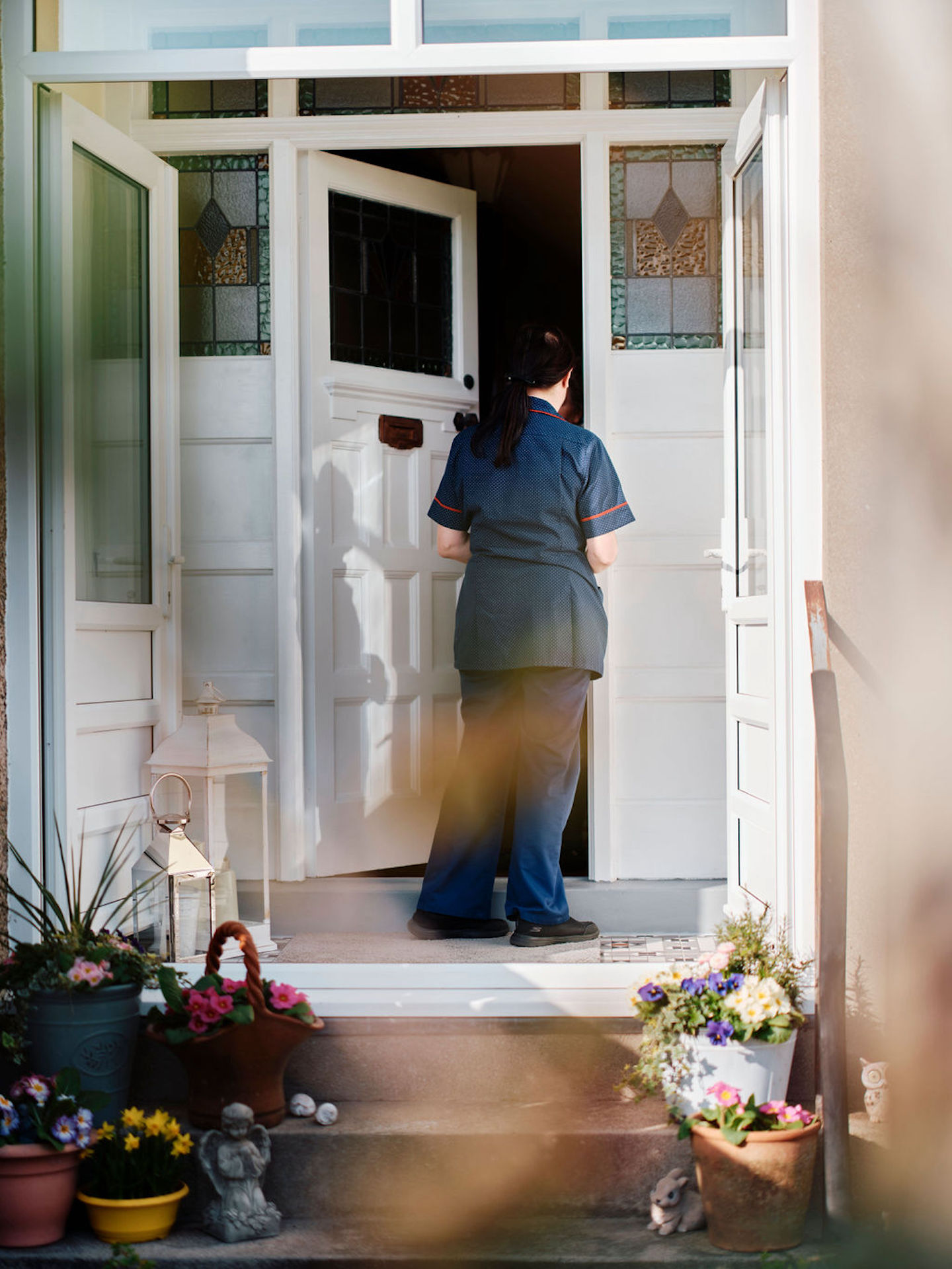 Image of community team nurse knocking on patients door
