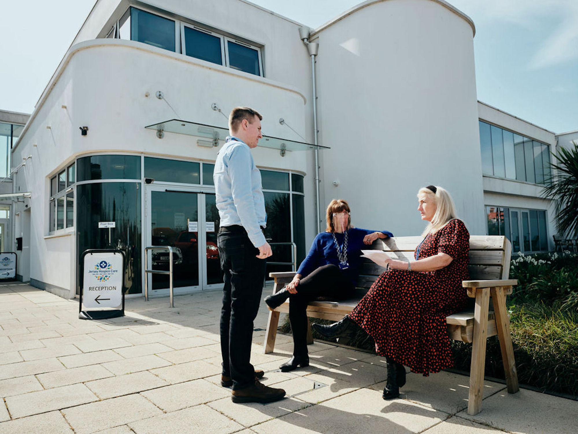 Image of staff taking outside Hospice building
