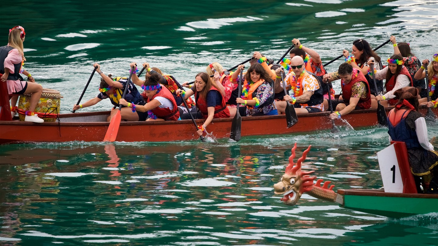 Image of two dragon boats racing