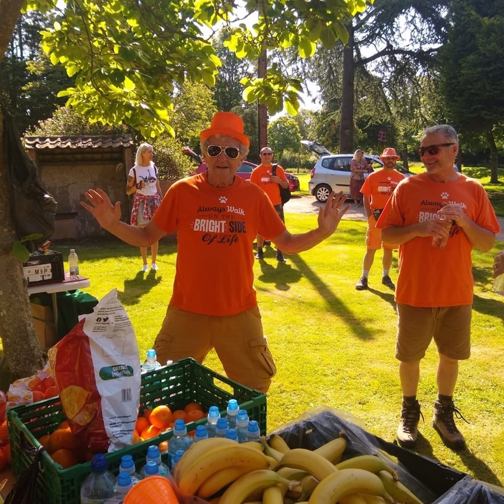 Image of man in Orange t-shirt at event