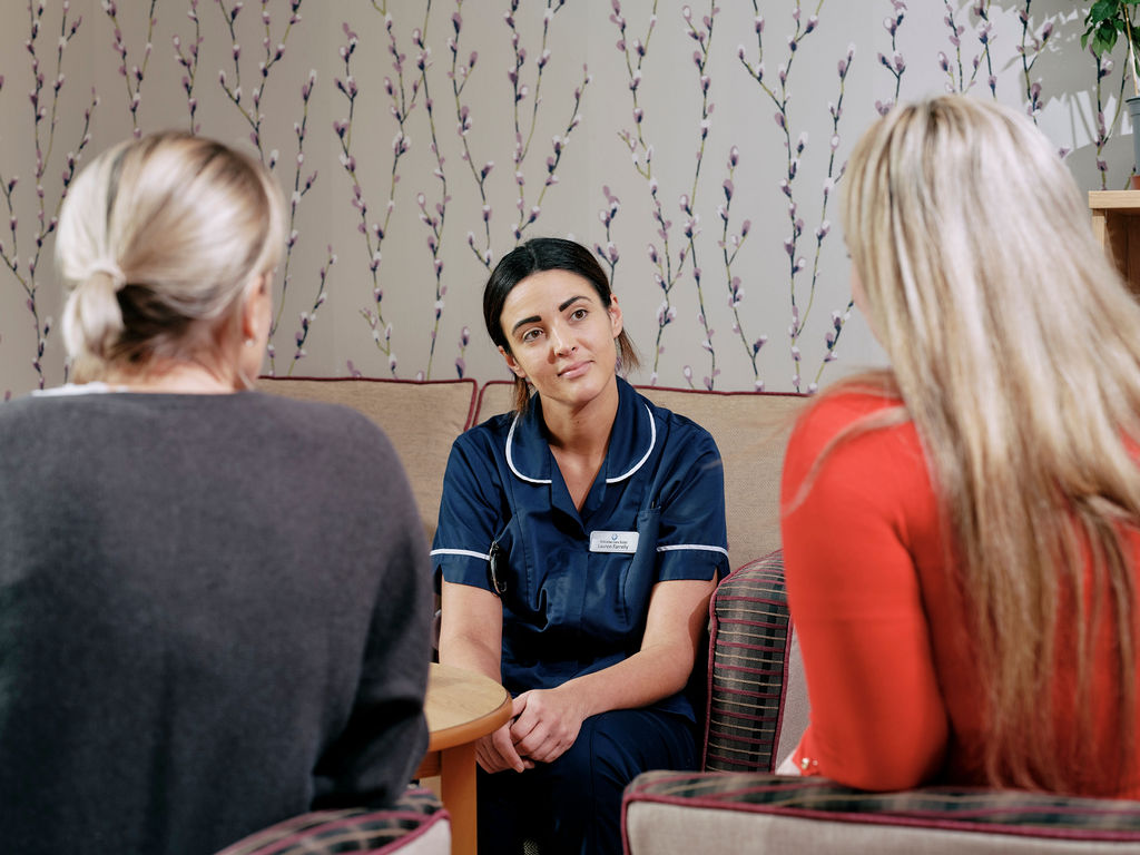 Nurse talking to family