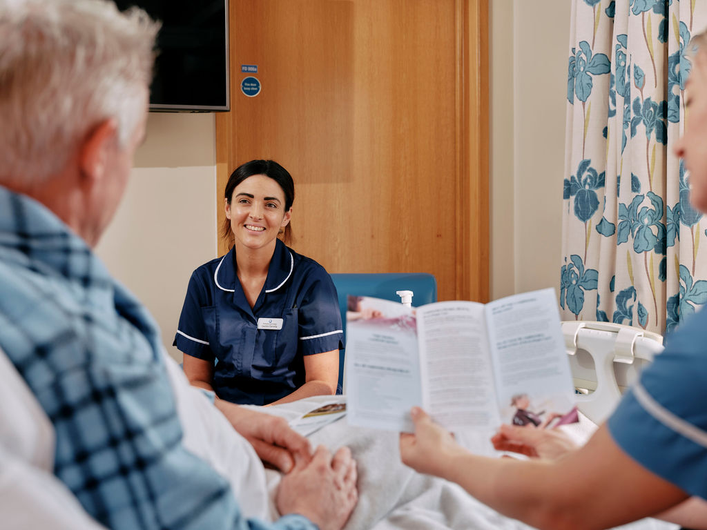 Nurse and patient with leaflet