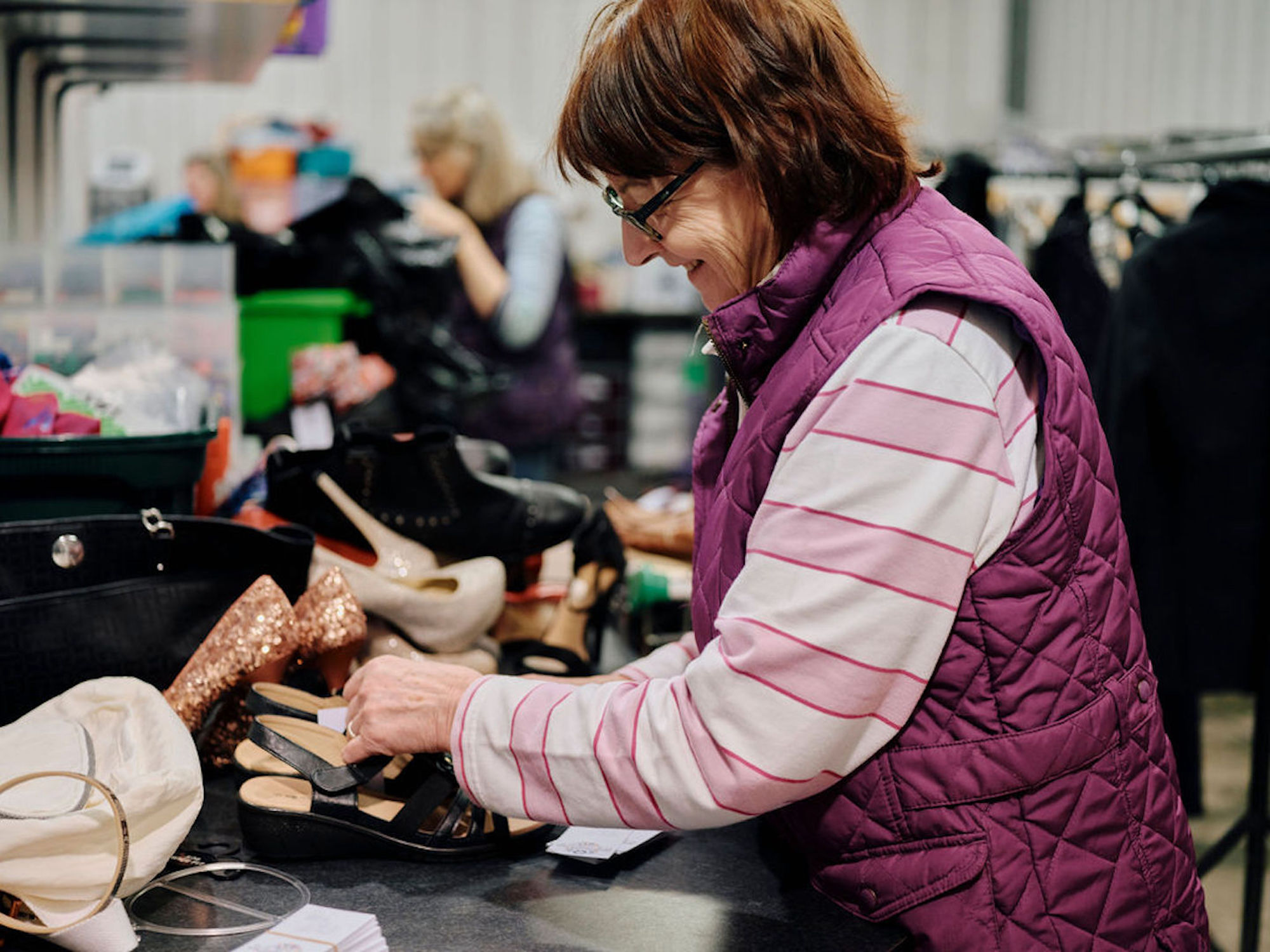 Image of volunteer sorting clothes