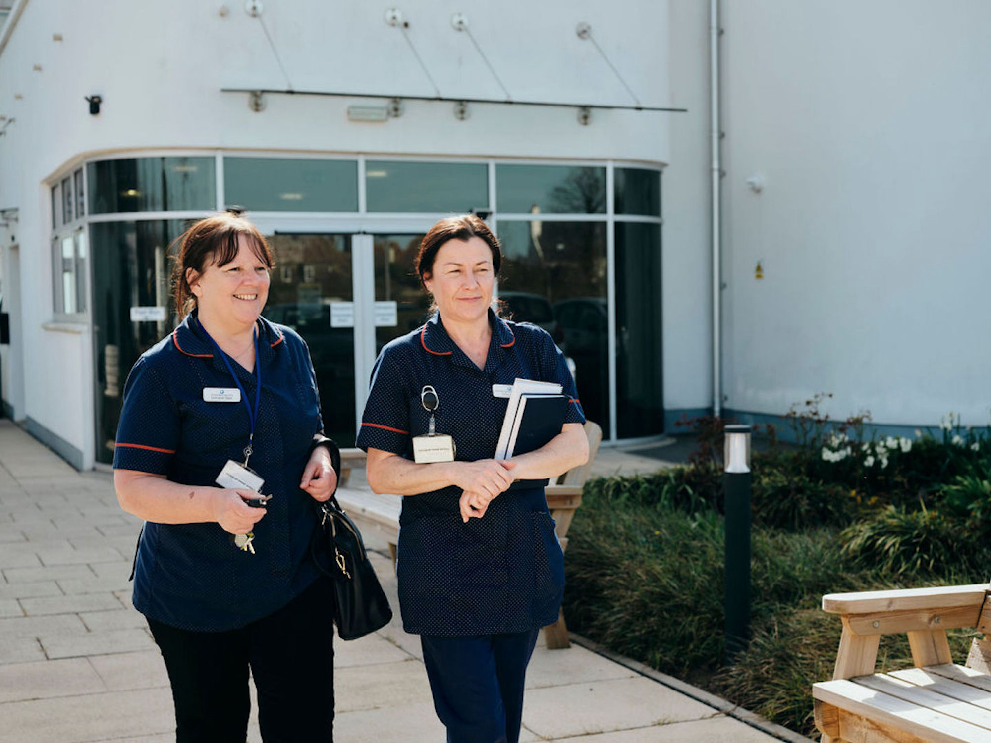 Image of Jersey Hospice Care nurses walking outside Hospice